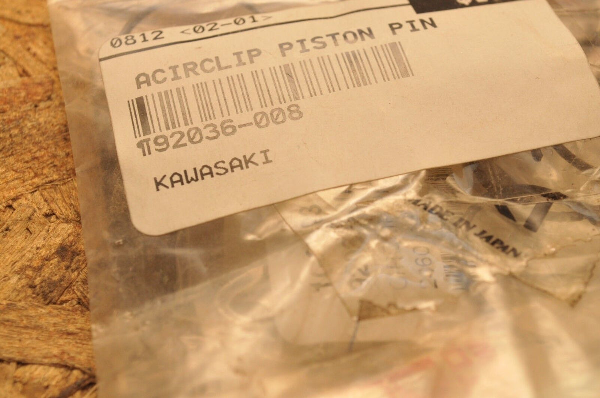 thumbnail image 2 of NOS Kawasaki 92036-004 Piston Pin Circlip – OEM For H1 H2 A1 KE KX KDX Models 2 of 5