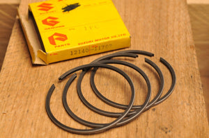 NOS OEM SUZUKI 12140-11702 RINGS RING SET(PISTON) +0.50 OS TC250 T20 1969 - Like New