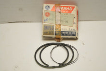 Load image into Gallery viewer, NOS OEM YAMAHA 248-11601-10-00  PISTON RING SET 305-02-02-06 OVERSIZE 0.25 AT1